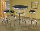 Close-up of black tabletop wrapped with chrome rim