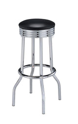 Side view of Theodore black cushioned bar stool with chrome frame