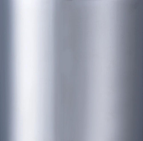 Close-up of black upholstered seat and chrome footrest on Theodore stool