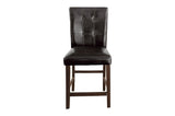 Close-up of table leg and chair upholstery