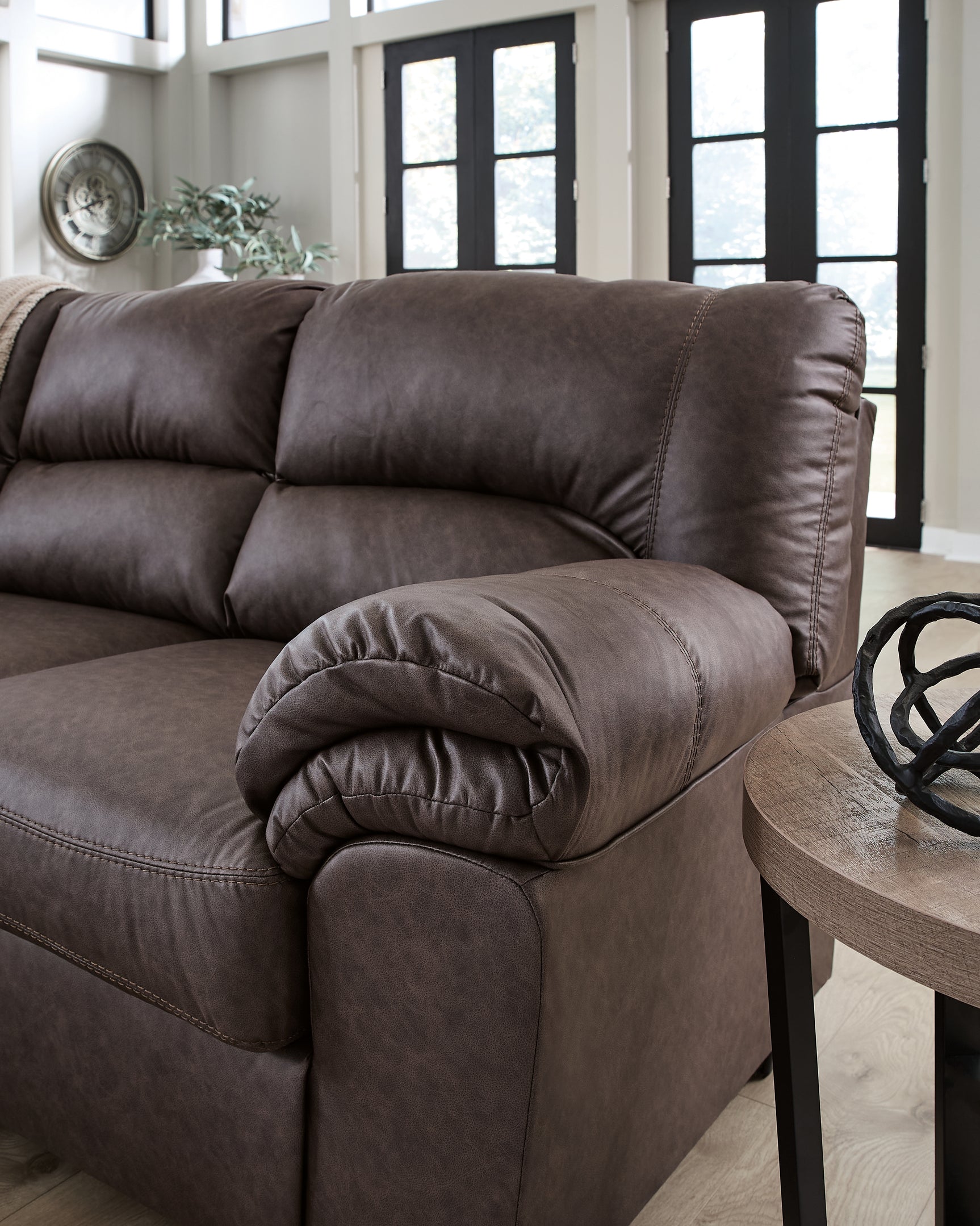 Close-up detail of armrest on WillowBend Umber sectional sofa