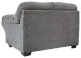 Close-up of loveseat's black nickel nailhead trim