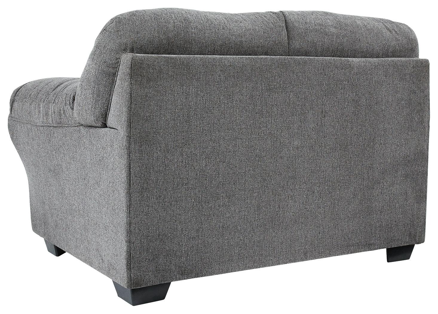 Close-up of loveseat's black nickel nailhead trim