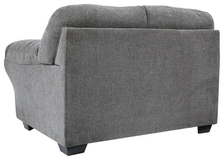 Close-up of loveseat's black nickel nailhead trim