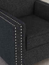 Detail close-up of chenille fabric and nailhead trim