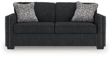 Close-up detail of sofa upholstery and accent nails