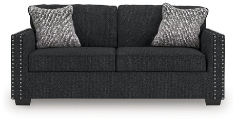 Close-up detail of sofa upholstery and accent nails