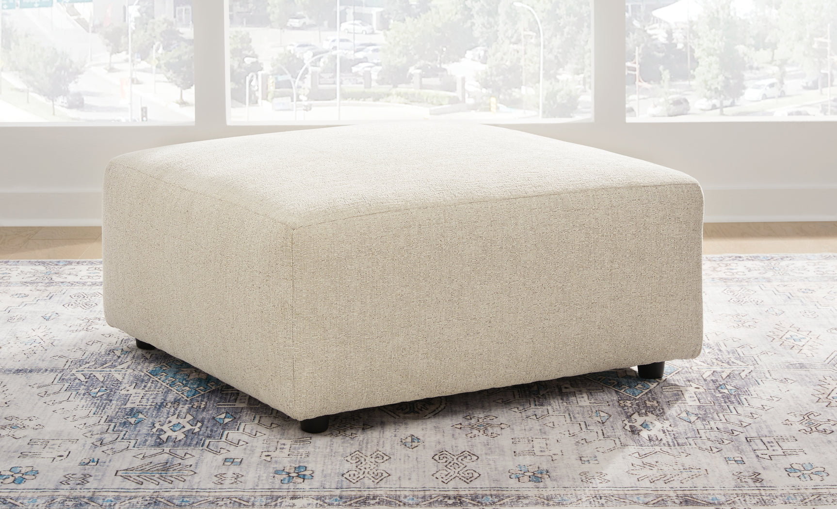 Side perspective of Edenfield Linen Sectional with Ottoman