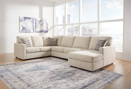 Living room view with Edenfield Linen Sectional and Ottoman