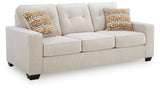 Close-up detail of sofa's armrest and fabric