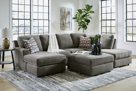 Room view with sectional sofa and ottoman
