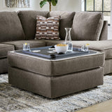 Built-in cup holder detail on ottoman cushion underside