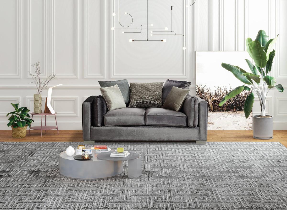 Side angle of Skylar gray velvet loveseat showing elegant design