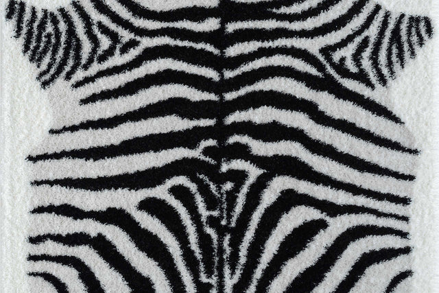 Comfy Shag Black and White area rug angled on living room floor