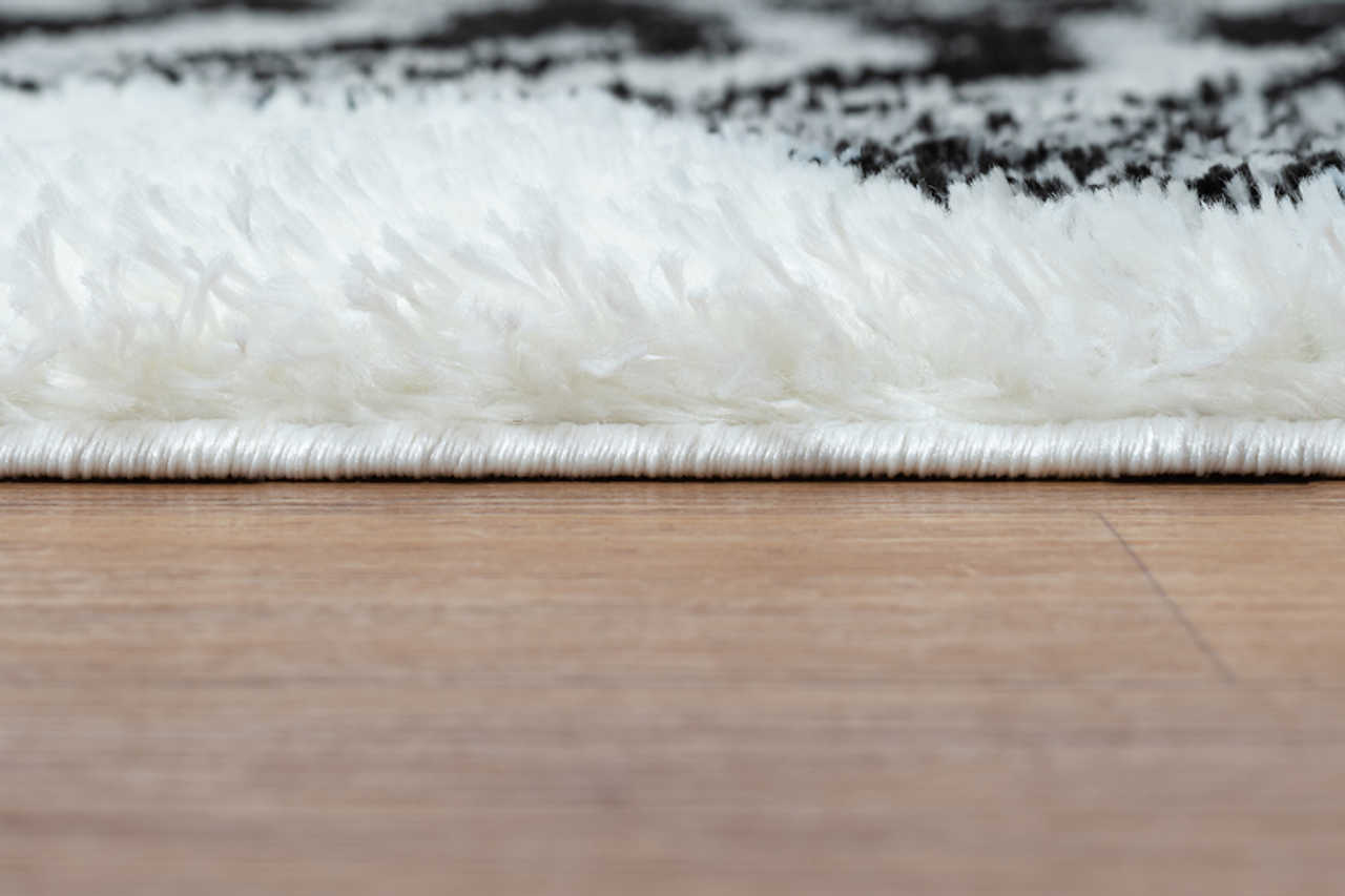 Top view of 5x7 black and white shag area rug