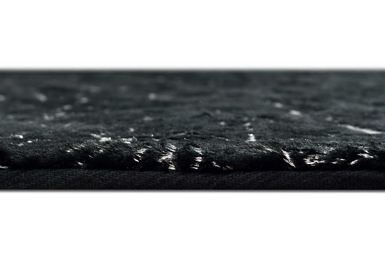 Side angle view of Rabbit Black and Silver rug on floor
