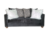 Detail of black velvet upholstery on Zander set