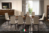 Eva Upholstered Dining Chair side view with walnut finish and brass legs