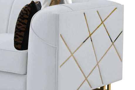 Side view of off-white velvet sofa with gold accents