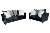 Side view of Zander black velvet loveseat