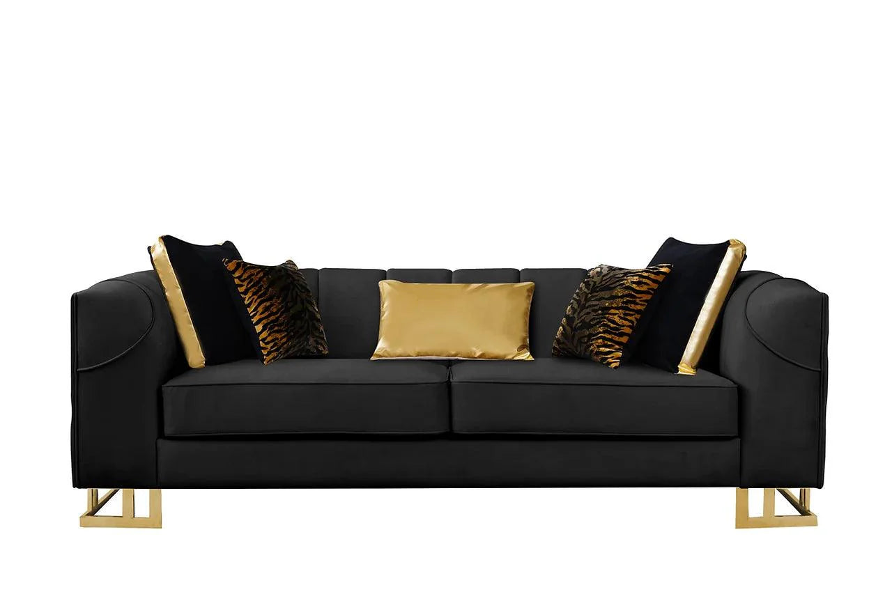 Close-up detail of black velvet upholstery with gold accents