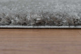 Comfy Shag Carbon rug displayed in living room