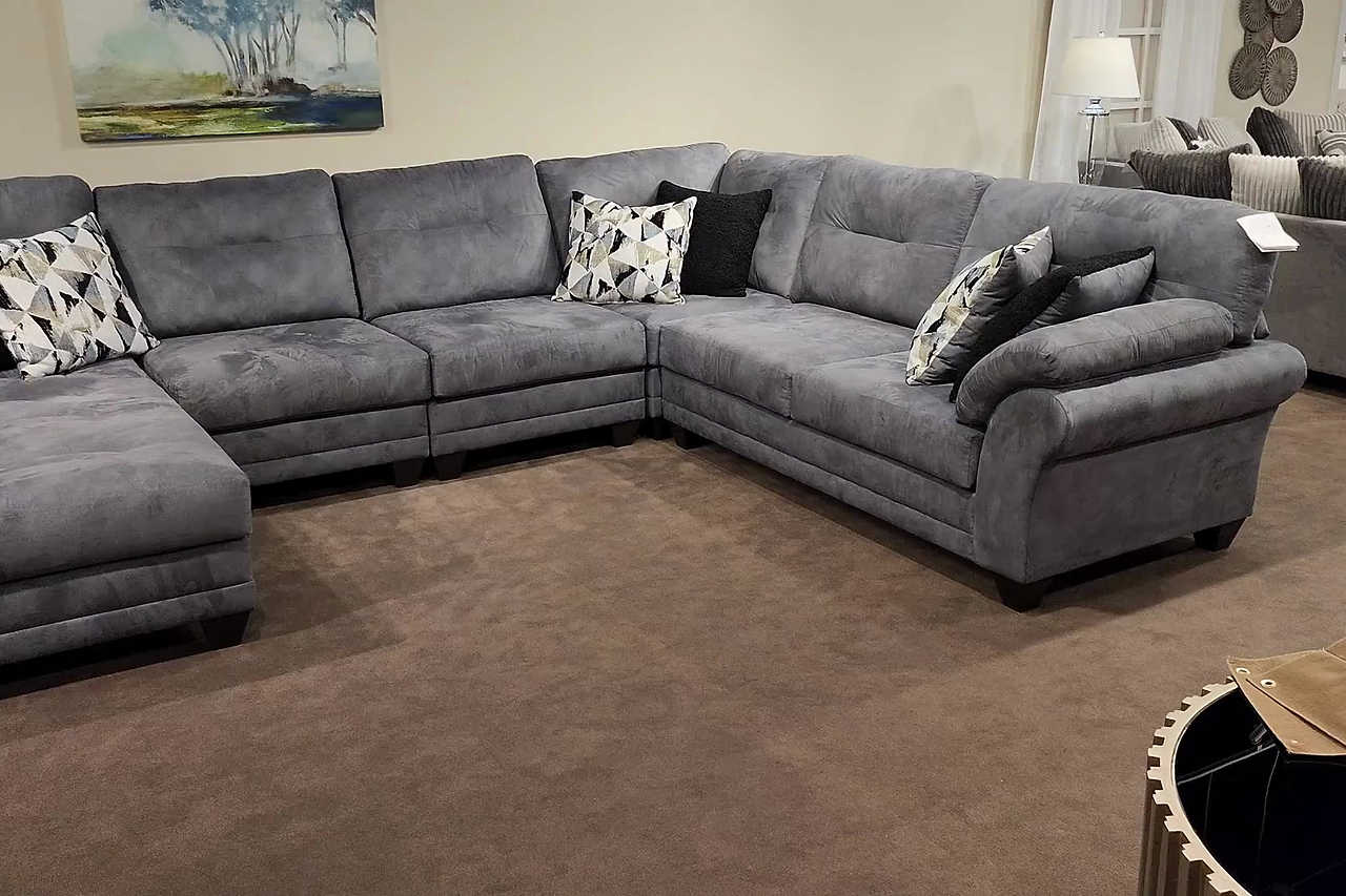 Living room view with Capulet Bayou Gray Sectional sofa