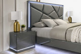 Closeup of upholstered gray headboard with LED lighting