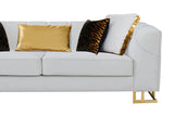 Close-up detail of gold accents on velvet upholstery