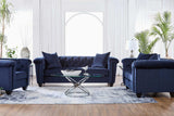 Close-up of tufted navy velvet upholstery on sofa