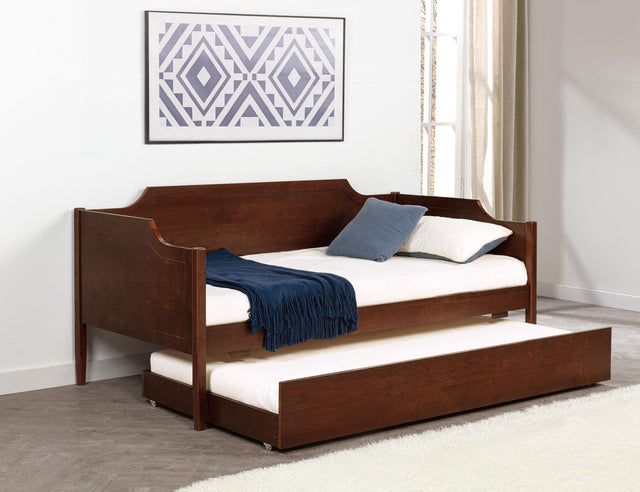 Daybed detail showing camelback silhouette and cherry finish