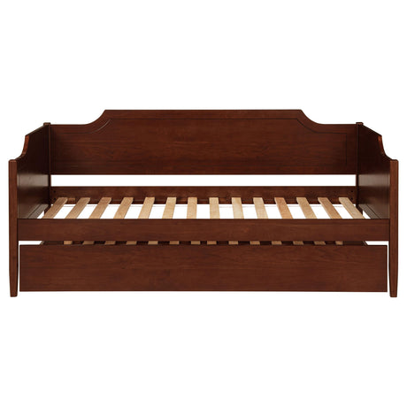 Twin daybed with trundle in a styled guest room setup