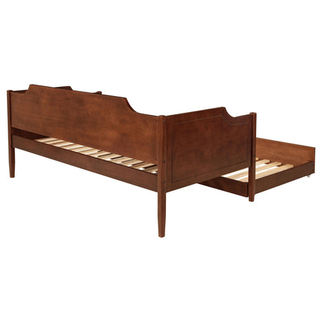 Close-up of cherry veneer finish on daybed frame