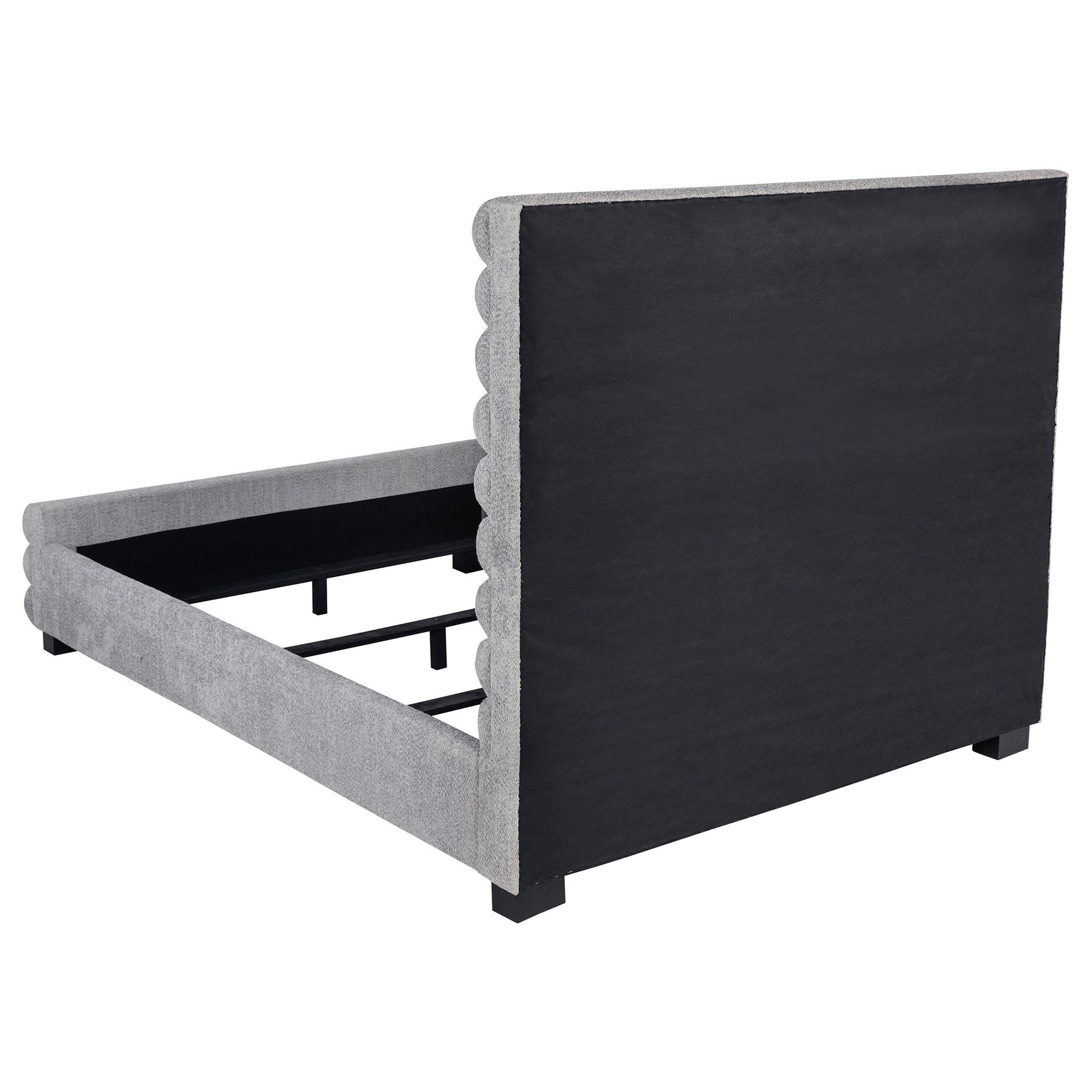 Black-finished legs supporting the upholstered bed frame