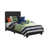 Dorian black upholstered twin bed side view showing tapered legs