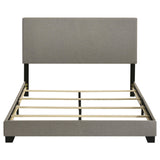 View of solid black wood legs on Dorian queen bed