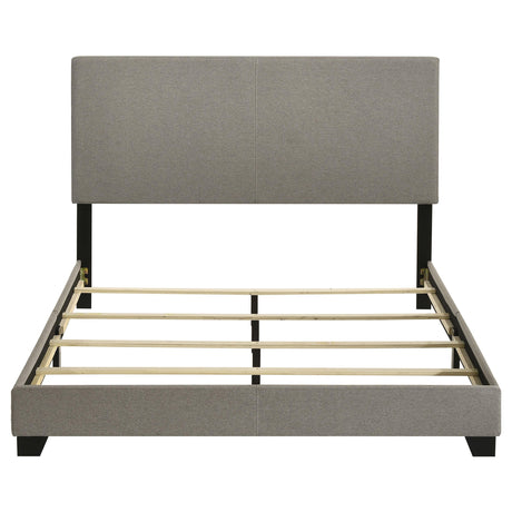 View of solid black wood legs on Dorian queen bed