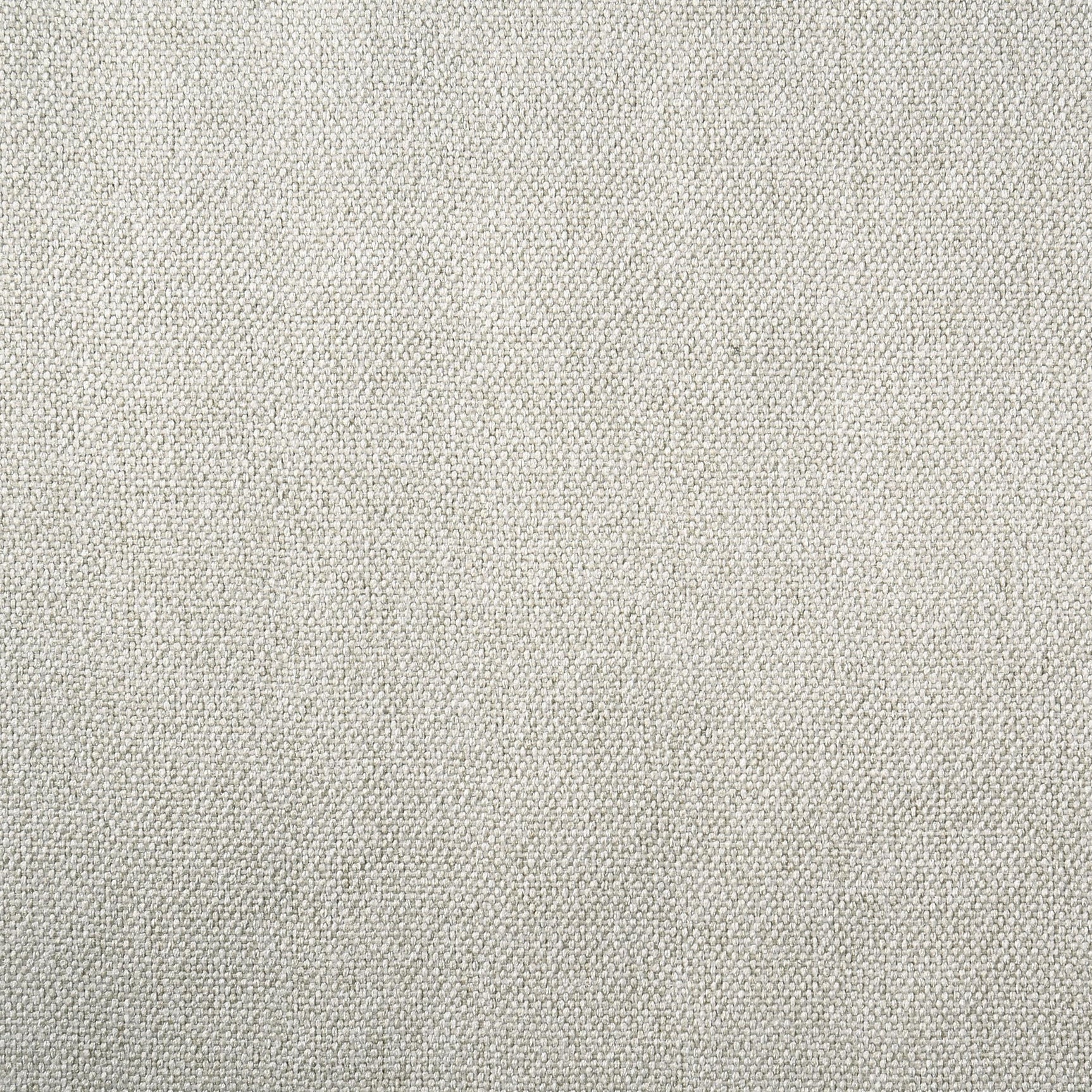 Close-up of cream fabric padded headboard on queen bed