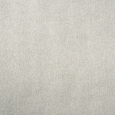 Close-up of cream fabric padded headboard on queen bed