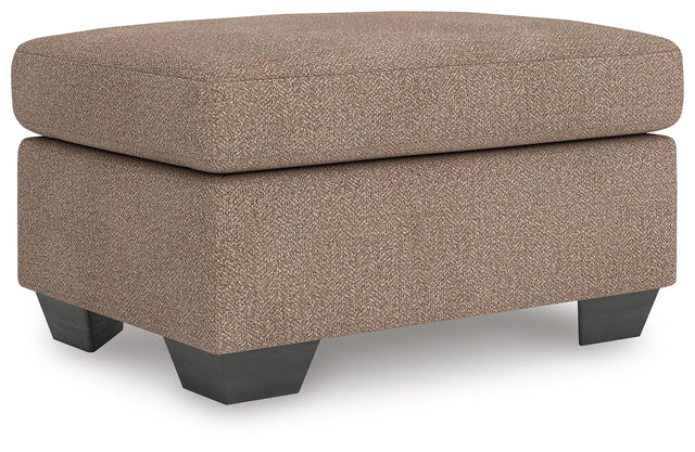Triston-Peaks Ottoman angled view showing upholstery and legs
