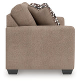 Triston-Peaks loveseat side view showing arm and cushion