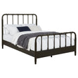 Side angle of Rocco Eastern King Bed showing slender spindles and ring accents