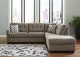 Room scene with Mahoney Chocolate 2-Piece Sleeper Sectional with Chaise sectional sofa