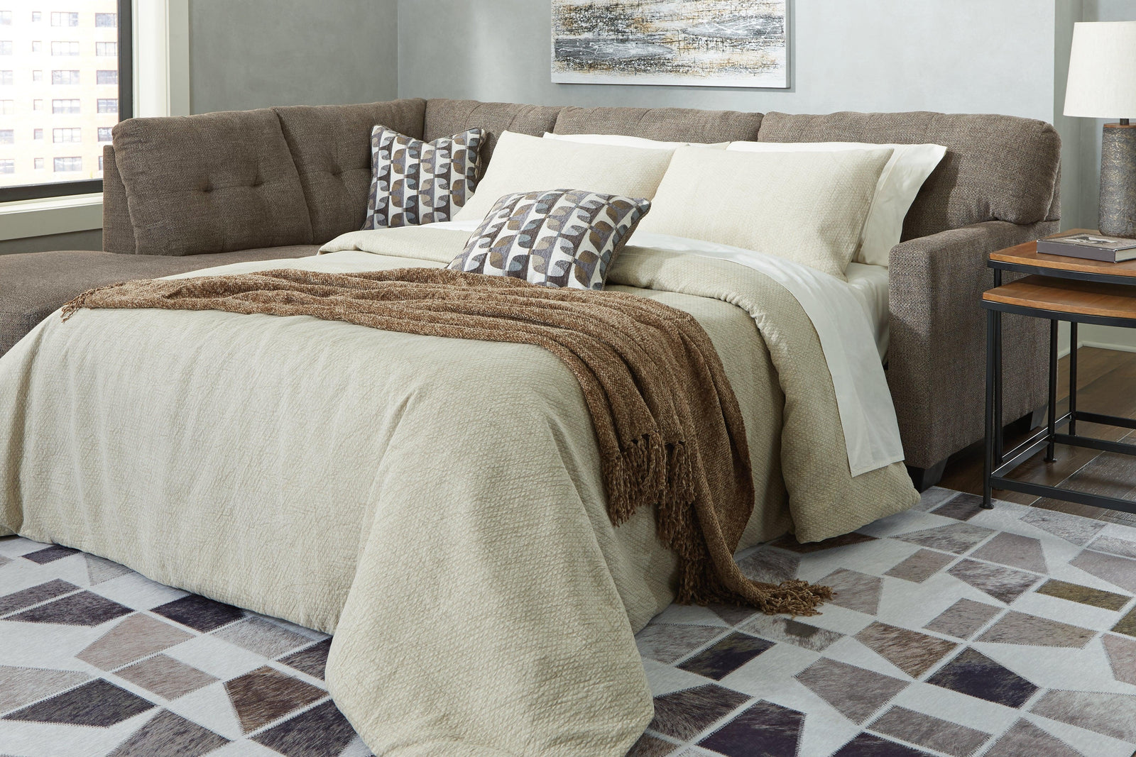 main view of Mahoney Chocolate 2-Piece Sleeper Sectional With Chaise sectional sofa
