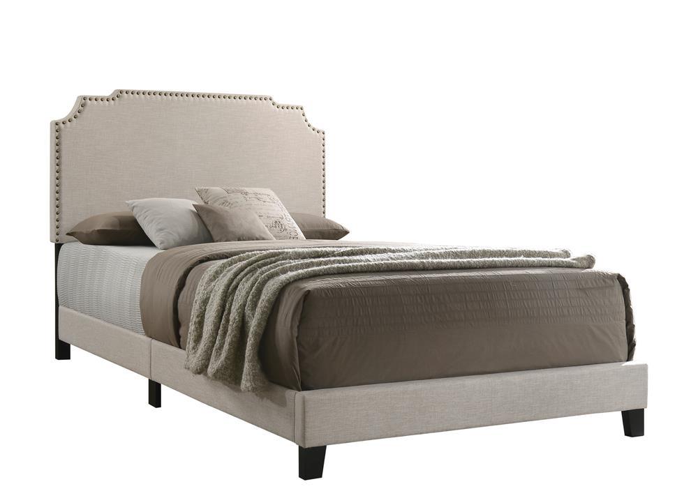 Tamarac Upholstered Nailhead Queen Bed beige angled view