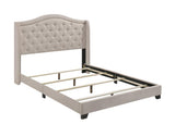 Close-up of button tufting and nailhead trim on Sonoma bed headboard