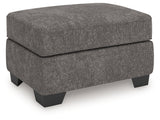 Olten Ottoman side angle view showing faux wood feet
