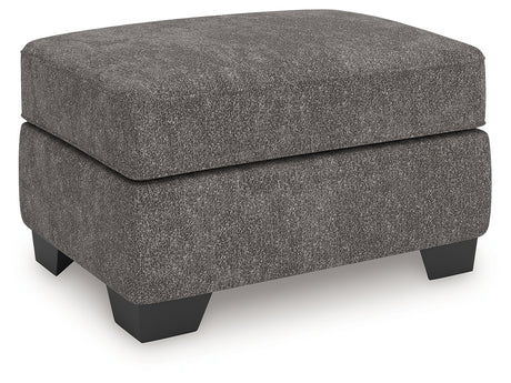 Olten Ottoman side angle view showing faux wood feet