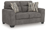Olten Loveseat close-up side angle showing fabric texture and pillow