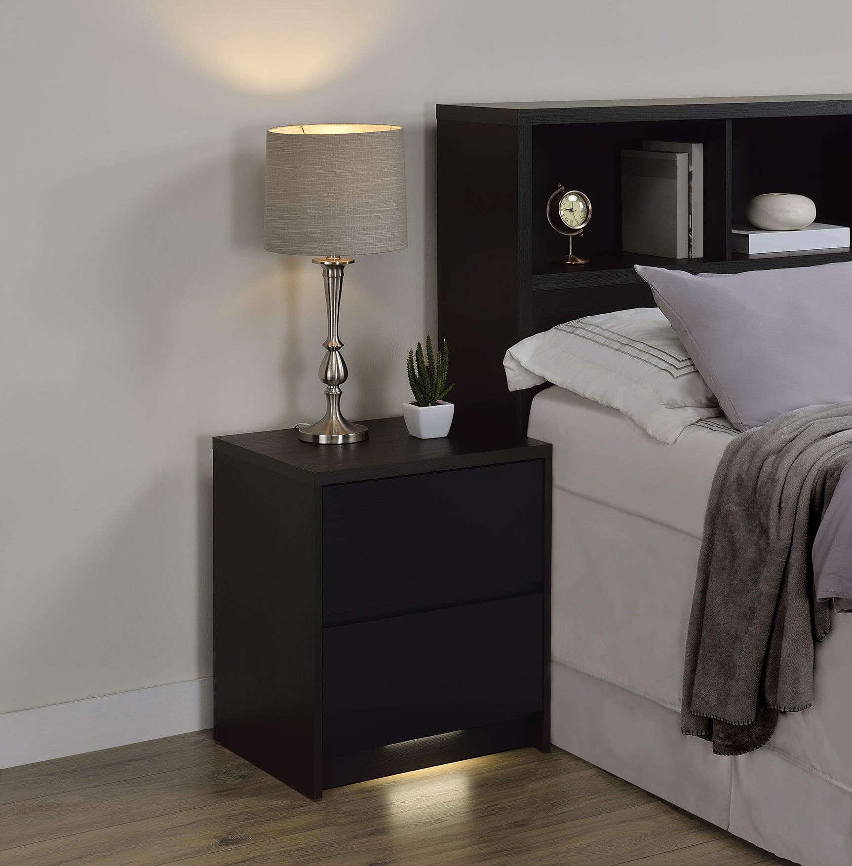 Close-up of LED motion sensor light at nightstand base
